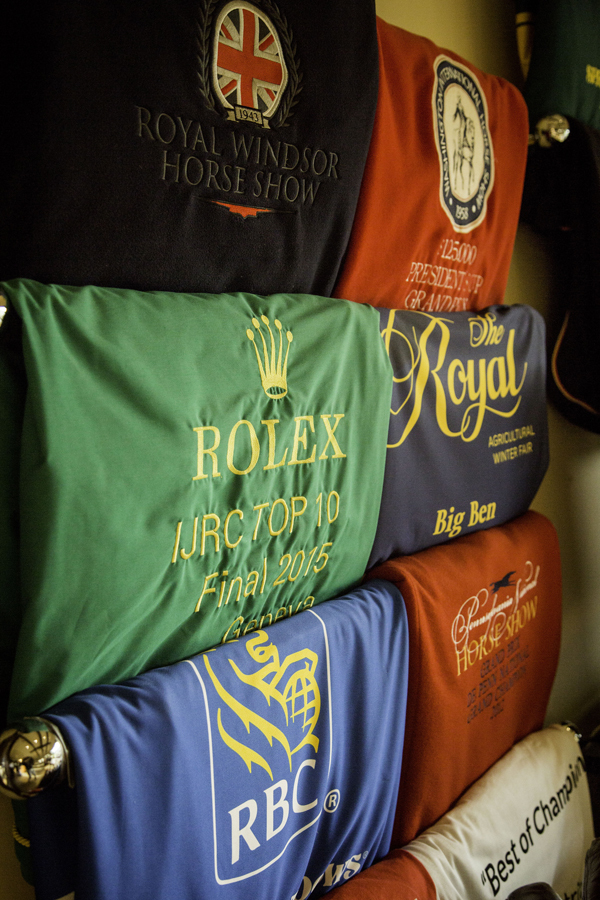 The prize rugs hanging in the barn